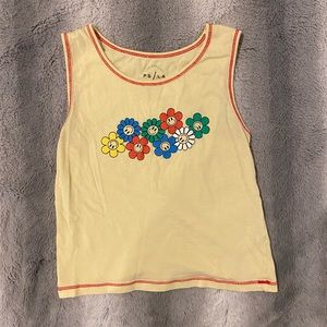 Yellow tank top with smiley flowers and red lining